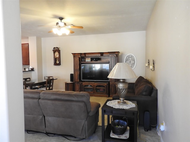 living room with light colored carpet and ceiling fan