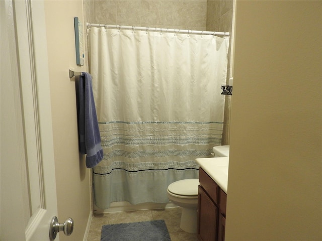 full bathroom featuring tile patterned floors, vanity, shower / tub combo, and toilet