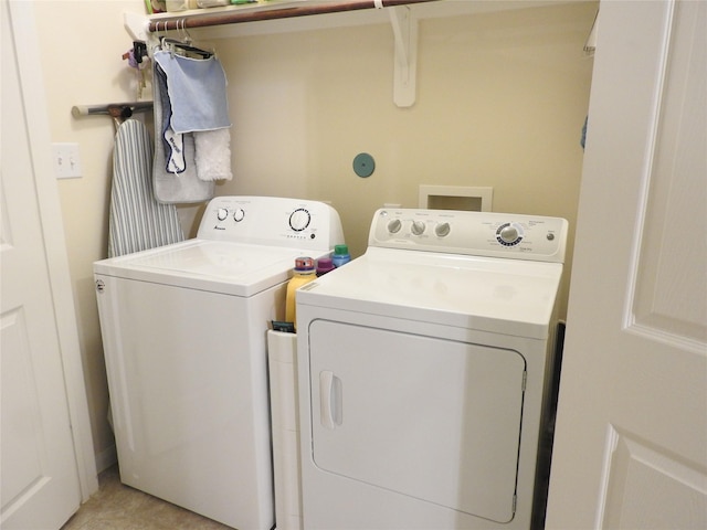 laundry room featuring washing machine and clothes dryer