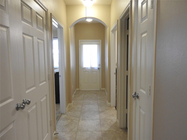 doorway featuring light tile patterned floors