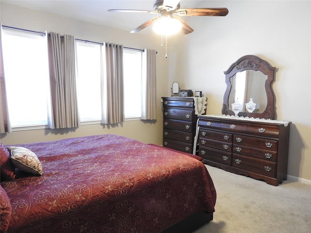 bedroom with ceiling fan and carpet