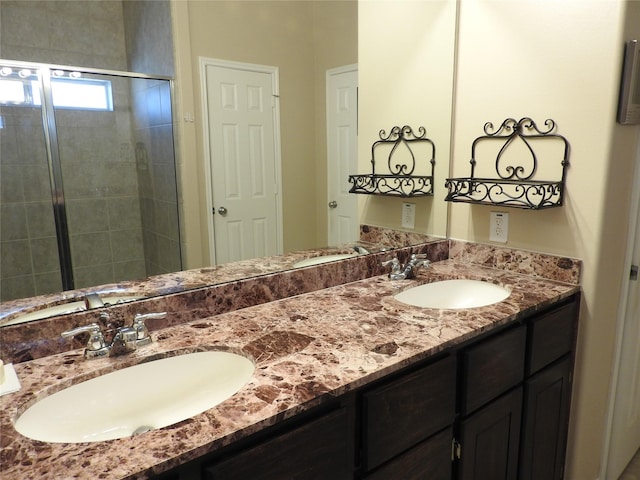 bathroom with vanity and an enclosed shower