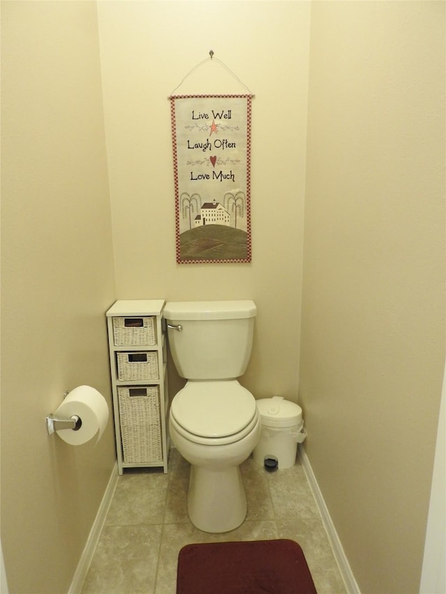 bathroom featuring tile patterned floors and toilet