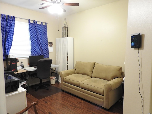 office space featuring dark hardwood / wood-style flooring and ceiling fan