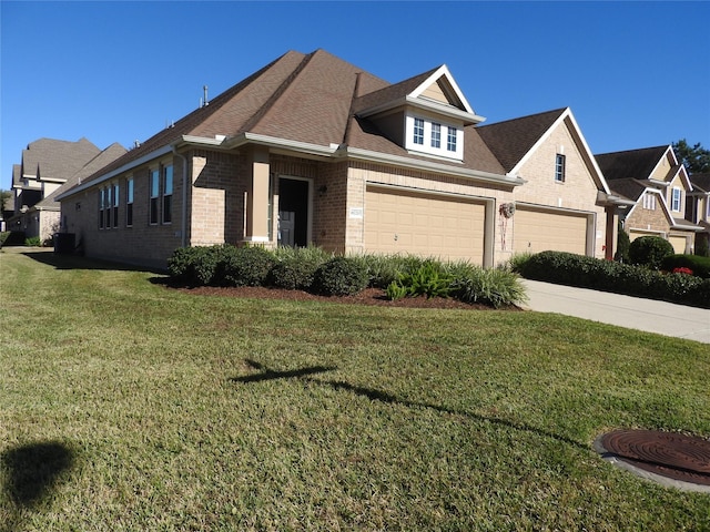 view of front of home featuring a front yard and a garage