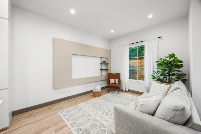 living area featuring hardwood / wood-style floors