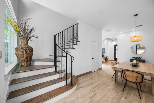 staircase featuring wood-type flooring