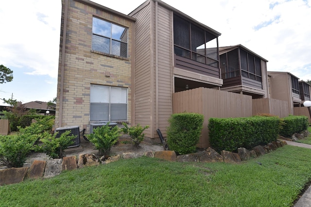 view of property exterior with a yard