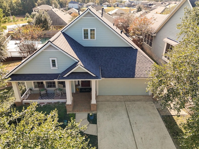 view of front of home featuring a garage and covered porch