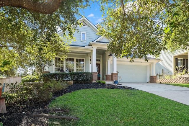 craftsman-style house featuring a garage and a front lawn