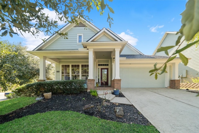 craftsman inspired home featuring a porch and a garage