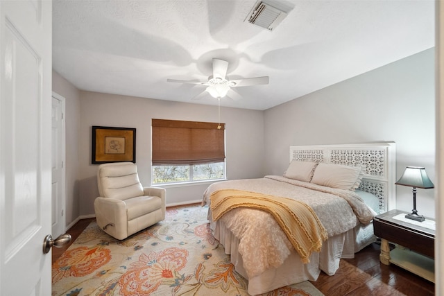 bedroom with hardwood / wood-style floors and ceiling fan