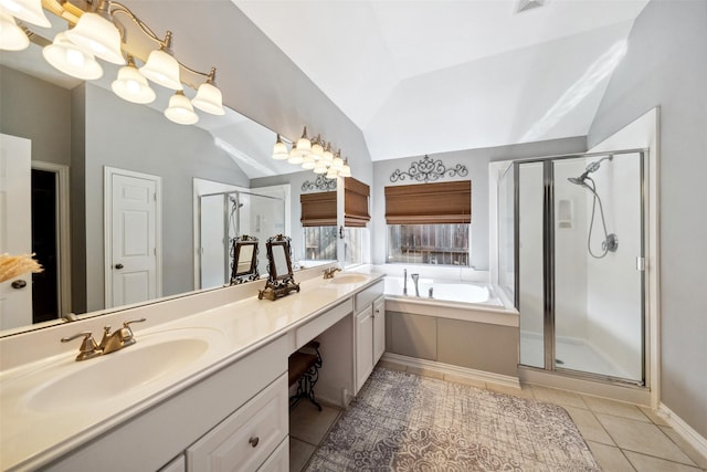 bathroom with tile patterned flooring, vanity, independent shower and bath, and vaulted ceiling