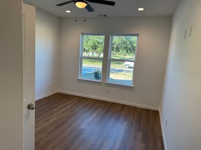 unfurnished room with ceiling fan and dark hardwood / wood-style floors