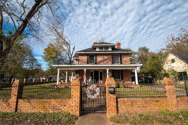 view of front of home featuring a front lawn and covered porch