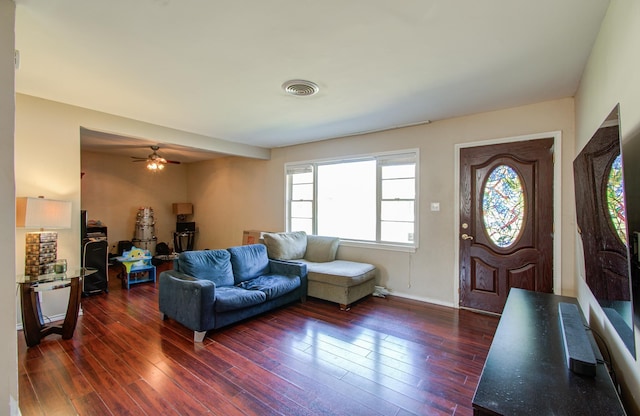 living room with ceiling fan and dark hardwood / wood-style floors