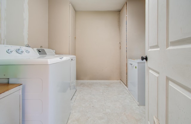 washroom with separate washer and dryer