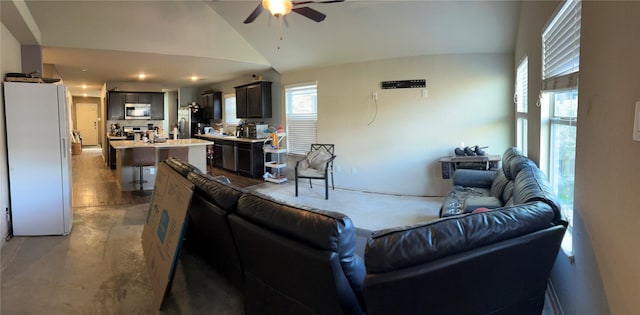 living room with high vaulted ceiling and ceiling fan