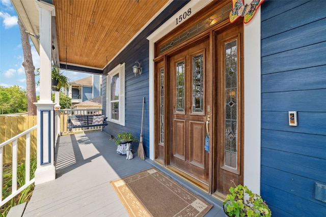 property entrance featuring a porch