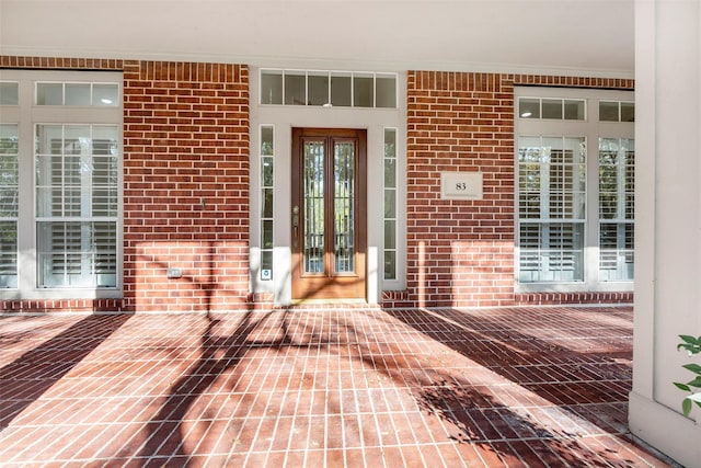 doorway to property featuring covered porch