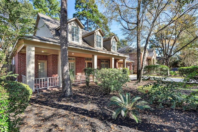 cape cod-style house with a porch