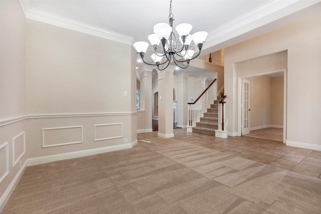 interior space featuring carpet floors, ornamental molding, and an inviting chandelier