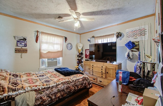 bedroom with ceiling fan, crown molding, dark hardwood / wood-style floors, and a textured ceiling