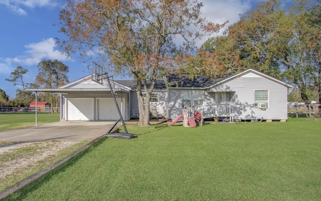 view of front facade featuring a garage and a front lawn