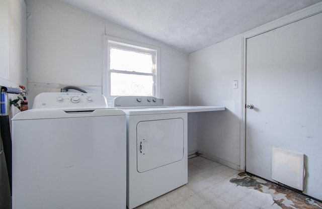 washroom featuring washing machine and clothes dryer