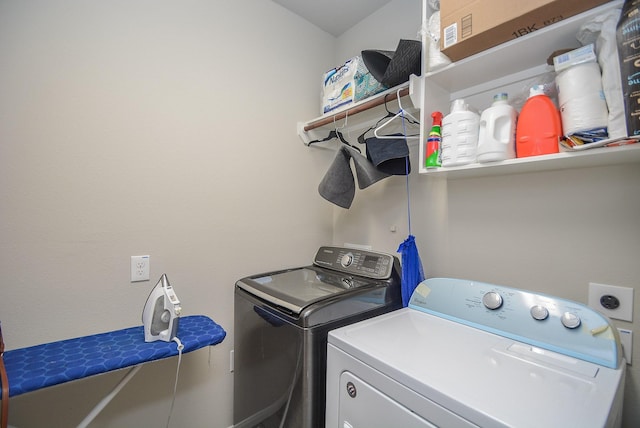 washroom with washing machine and clothes dryer