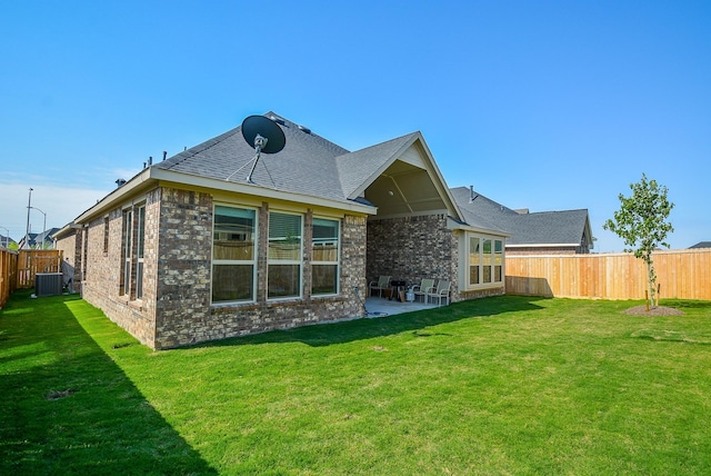 back of house with a patio, cooling unit, and a lawn