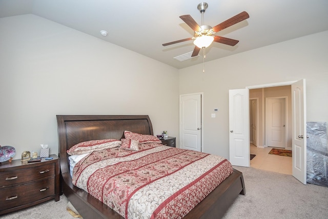 carpeted bedroom featuring ceiling fan and lofted ceiling