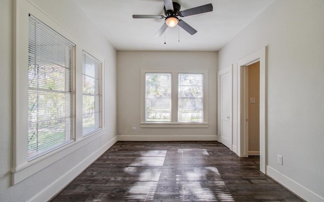 unfurnished room featuring dark hardwood / wood-style floors and ceiling fan