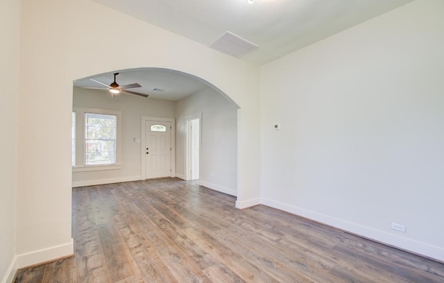 entrance foyer with ceiling fan and light hardwood / wood-style floors