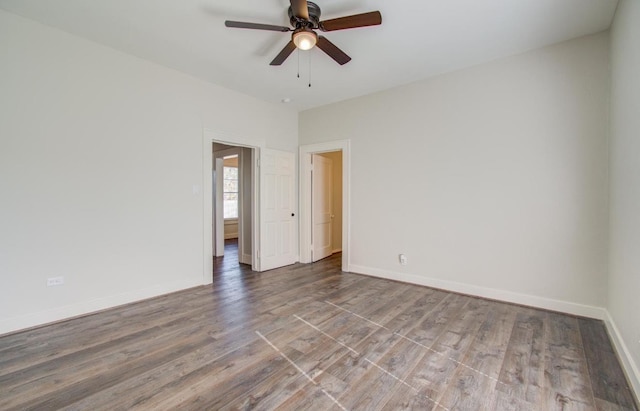 unfurnished room featuring ceiling fan and hardwood / wood-style flooring