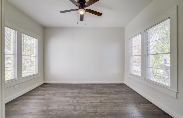 spare room with hardwood / wood-style flooring and ceiling fan