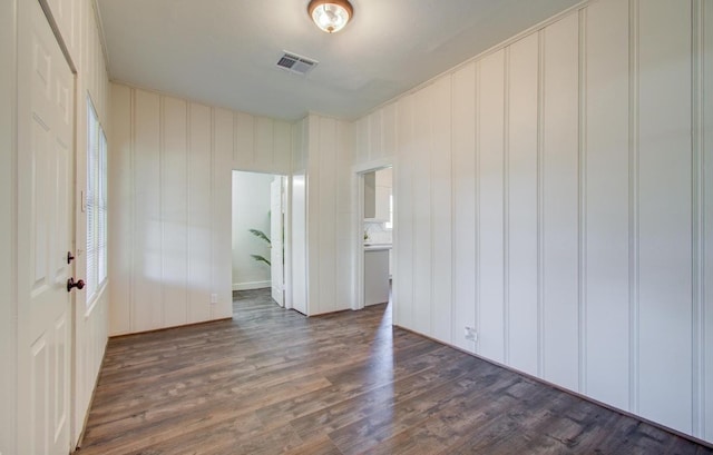 empty room featuring dark hardwood / wood-style flooring