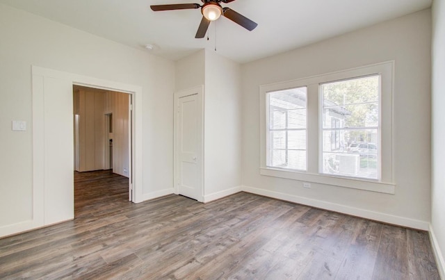 empty room featuring ceiling fan and hardwood / wood-style flooring