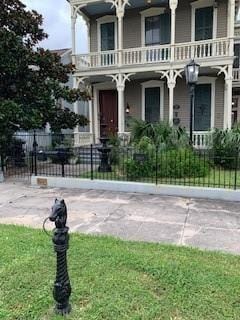 view of front of home with a balcony