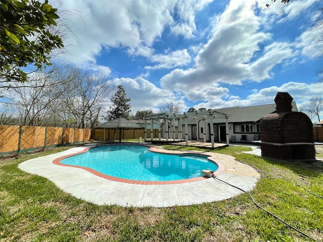 view of pool featuring a patio area and a yard