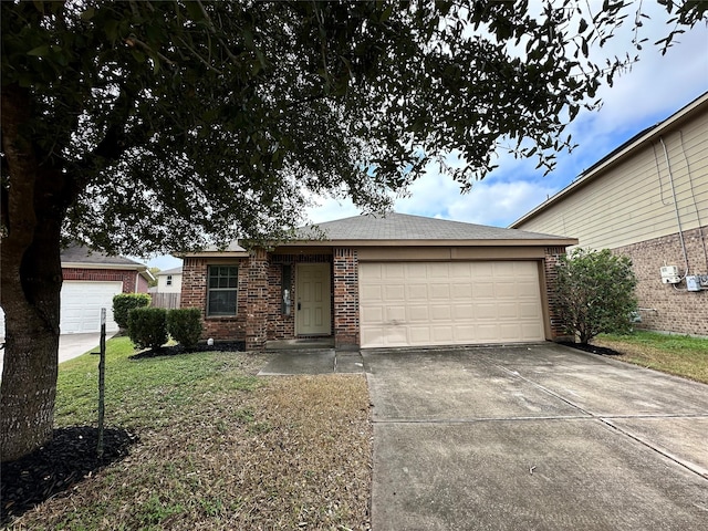 ranch-style home with a garage and a front yard