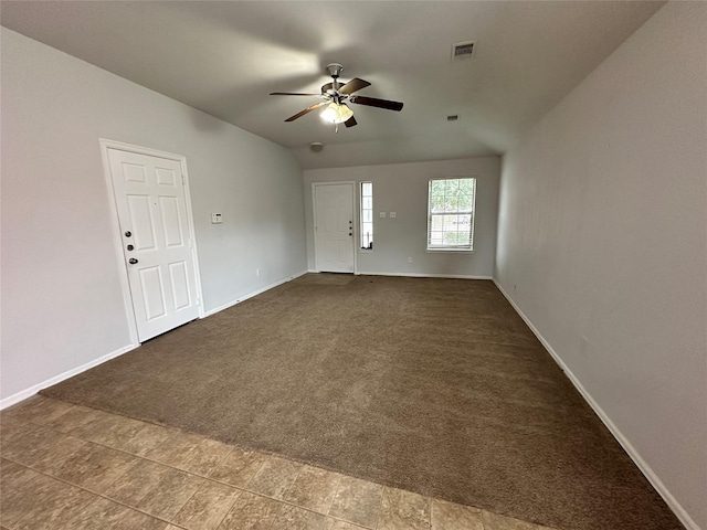 empty room with carpet, ceiling fan, and lofted ceiling