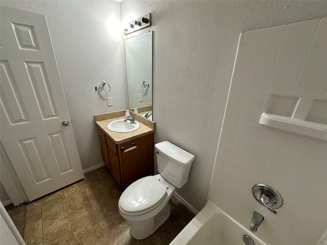 full bathroom with vanity, tub / shower combination, and toilet