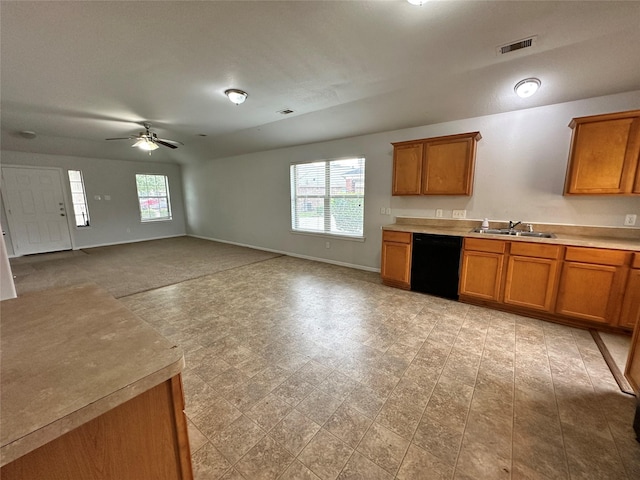 kitchen featuring ceiling fan, a healthy amount of sunlight, sink, and black dishwasher