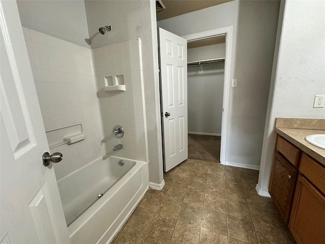 bathroom featuring vanity and washtub / shower combination