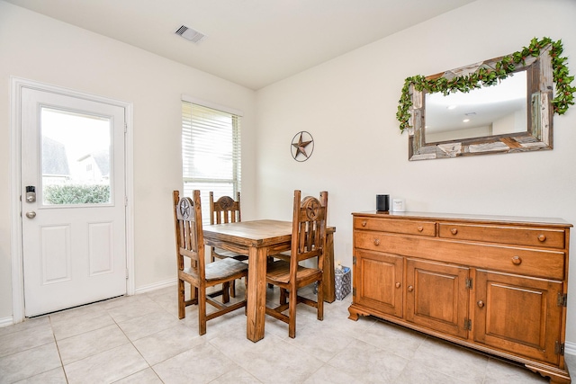 dining space with light tile patterned floors