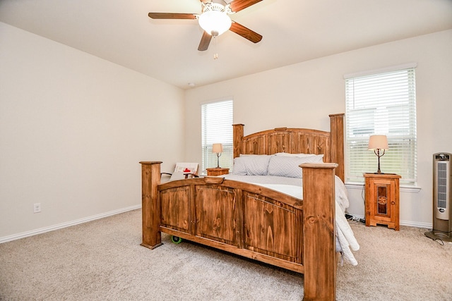 bedroom featuring light carpet and ceiling fan