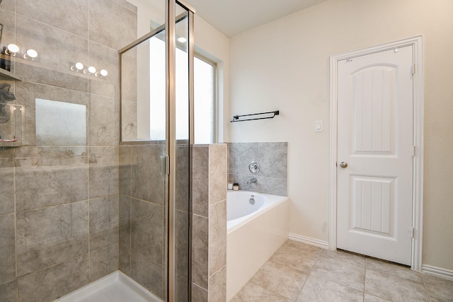 bathroom with tile patterned flooring and independent shower and bath