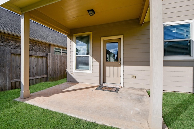 property entrance featuring a patio area