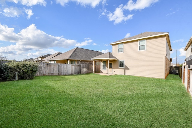 back of house with a yard